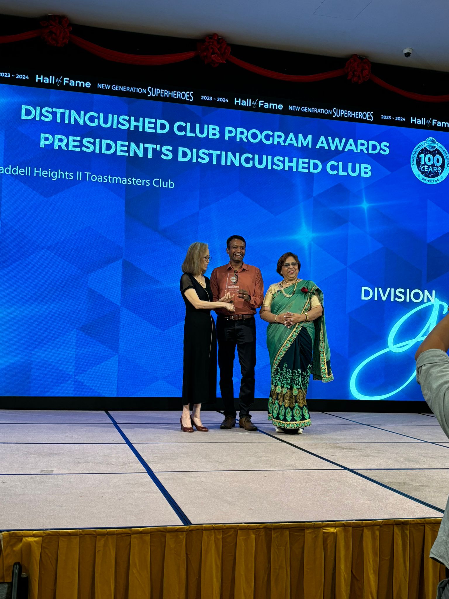 BH II receiving President's Distinguished Club award at District 80 Hall of Fame 2023-2024